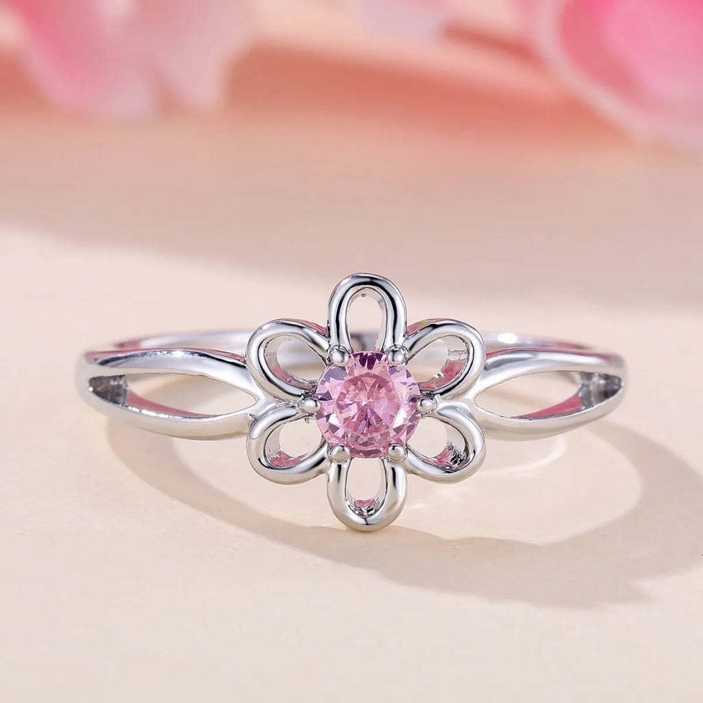 Women's hollow floral fashion ring in copper with electroplated finish, shown in platinum pink diamond colour.