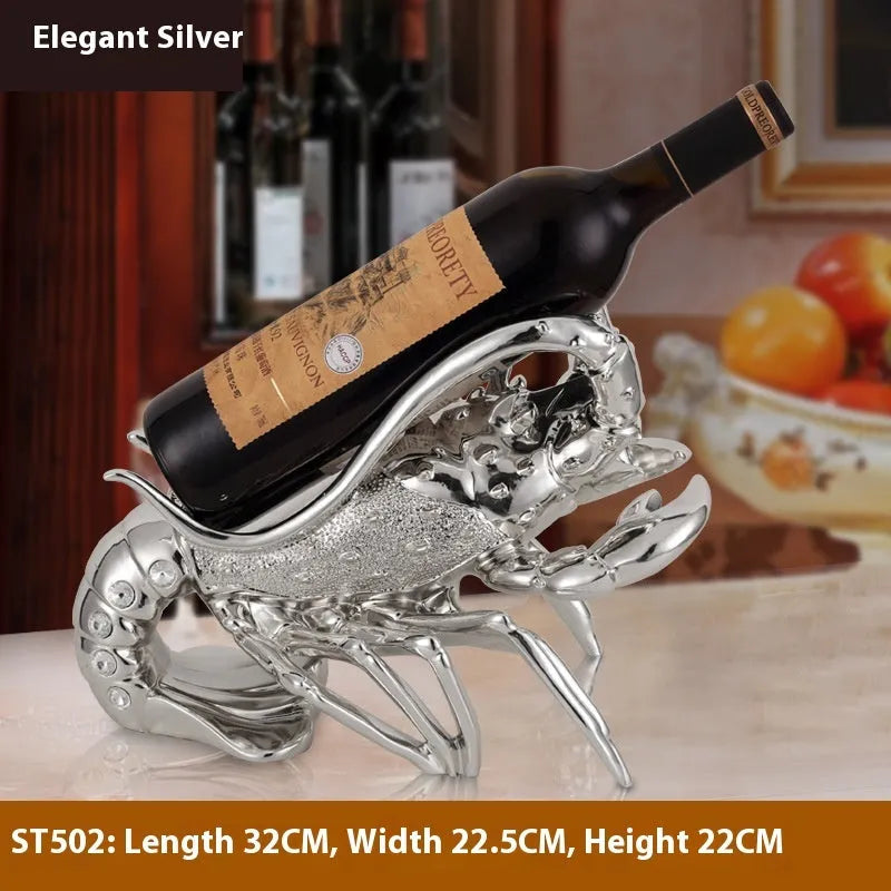 Metallic rose gold lobster-shaped resin ornament holding a wine bottle.