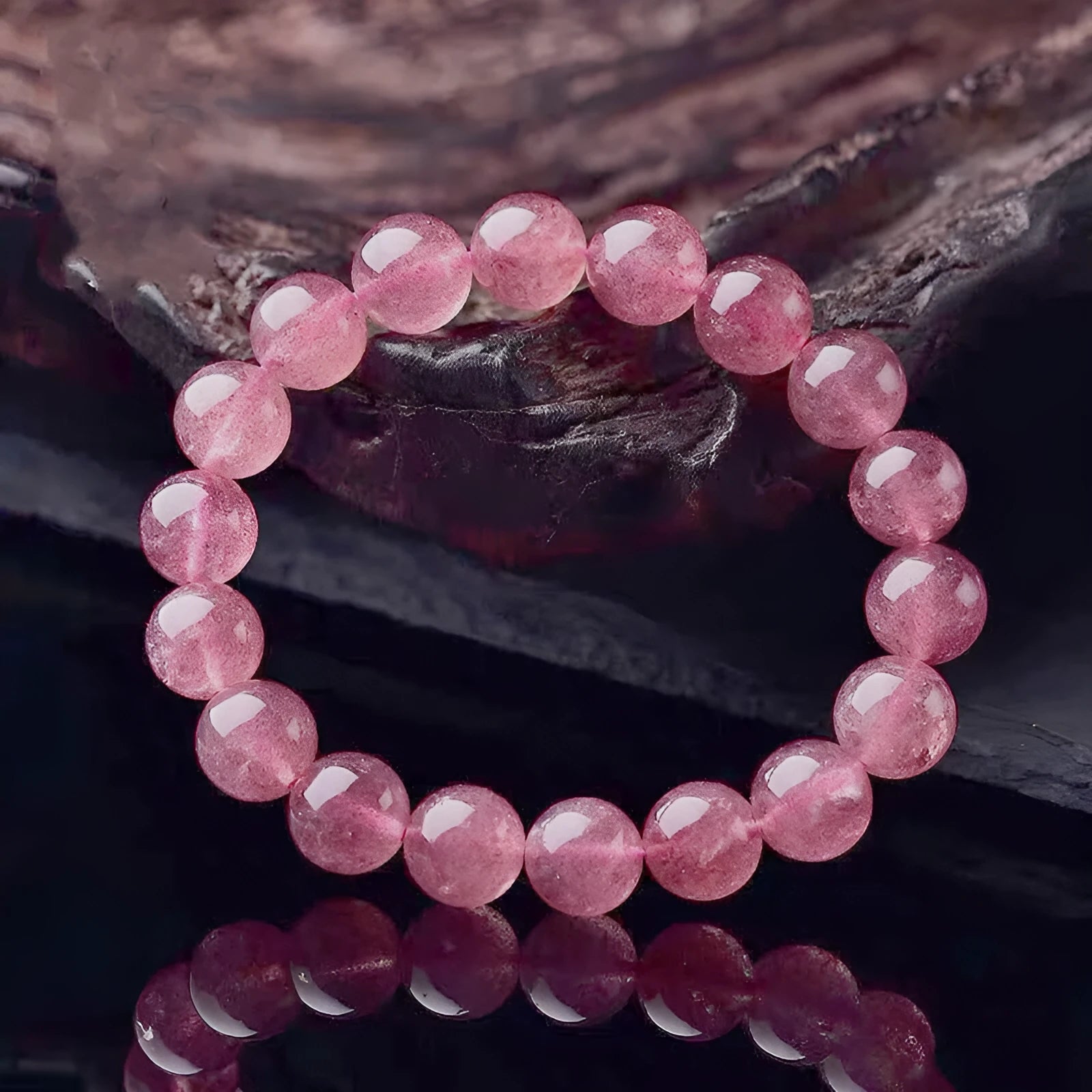 Women's strawberry quartz bracelet with 6mm, 8mm, and 10mm polished crystal beads