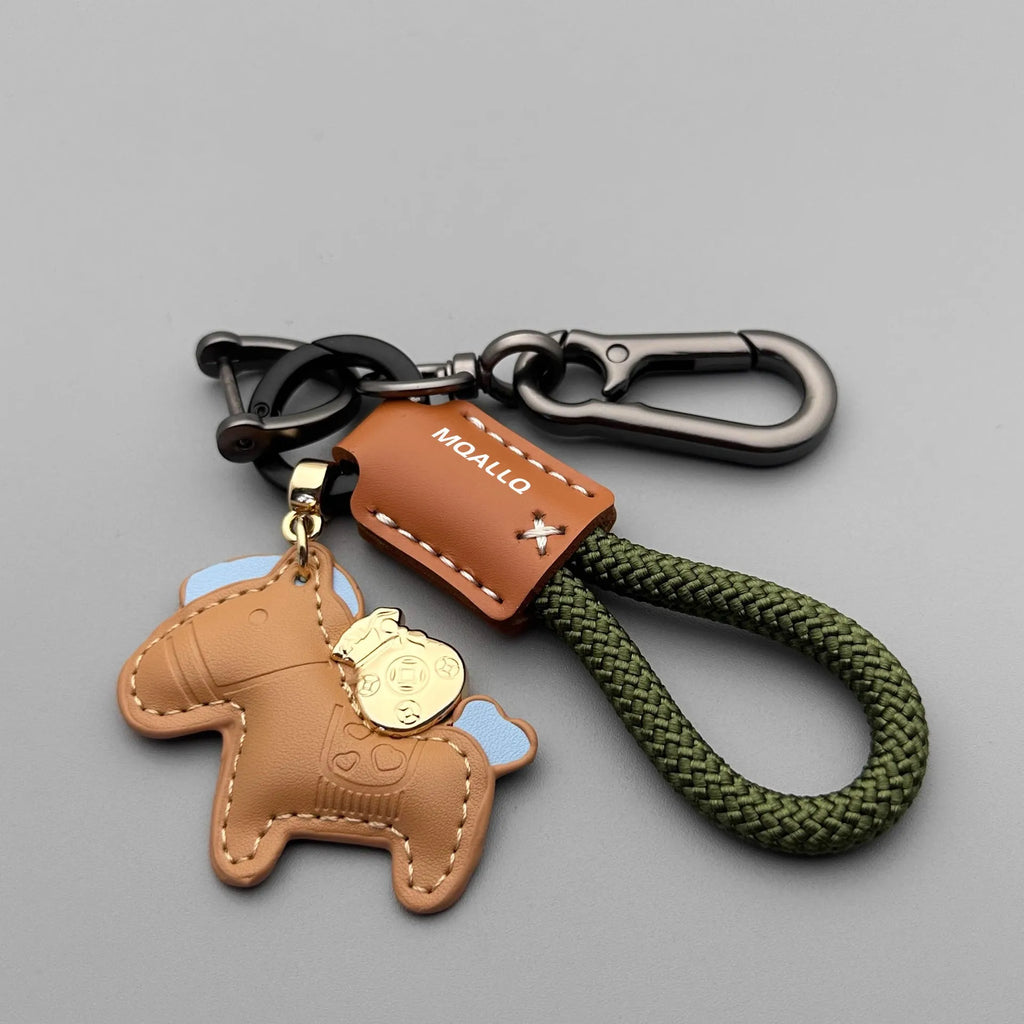 Handmade zinc alloy cowhide car key pendant on a flannel rope strap in various colour options.