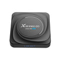 Android TV set-top box with remote control and HDMI cable on a colour box packaging.