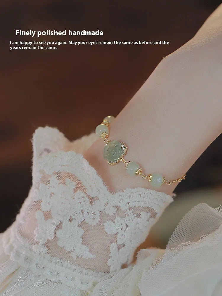Women's bracelet with Hetian jade rose colour, floral shape, rose elements, and 14K gilded finish.