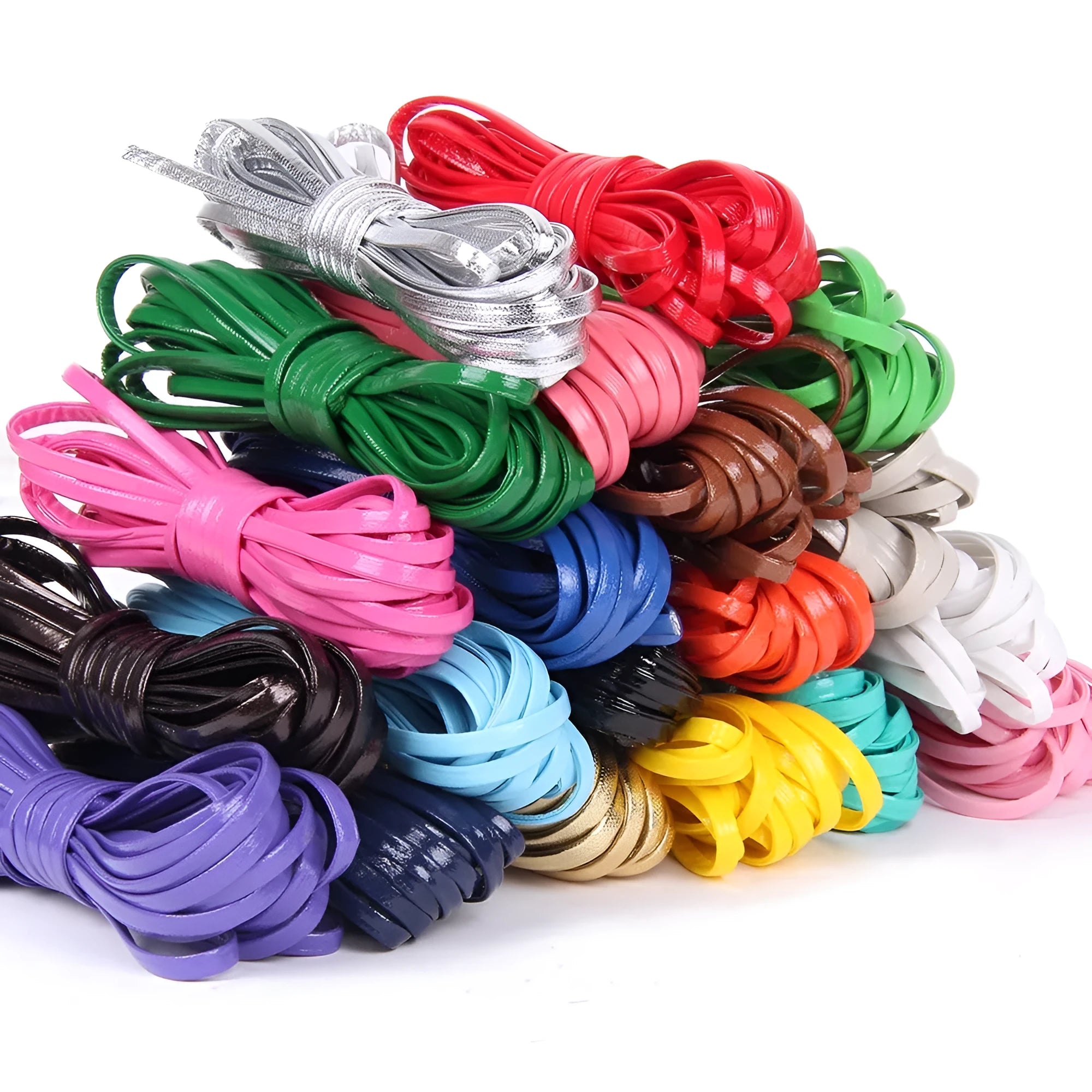 Spool of braided PU leather craft cord in beige, showing texture and width next to scissors on a craft table.
