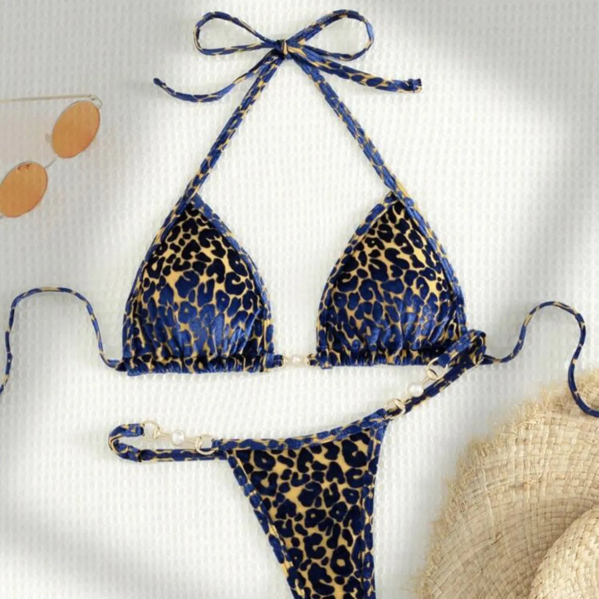 Blue leopard print women's bikini set on a mannequin, showing triangle top and briefs style.
