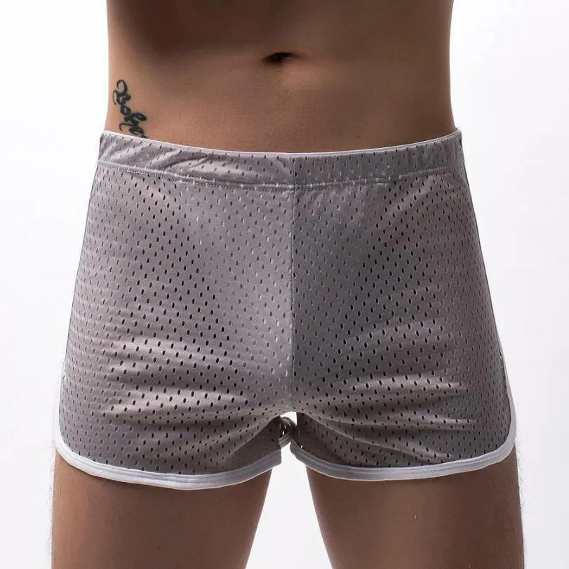 Men's grey cotton blend three-point boxer shorts laid flat, showing mid-waist design.