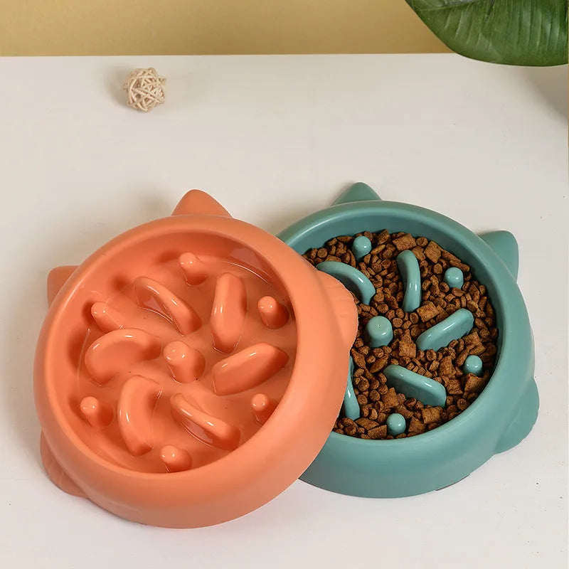 Green bone-shaped slow feeder bowl for dogs to prevent fast eating and choking.