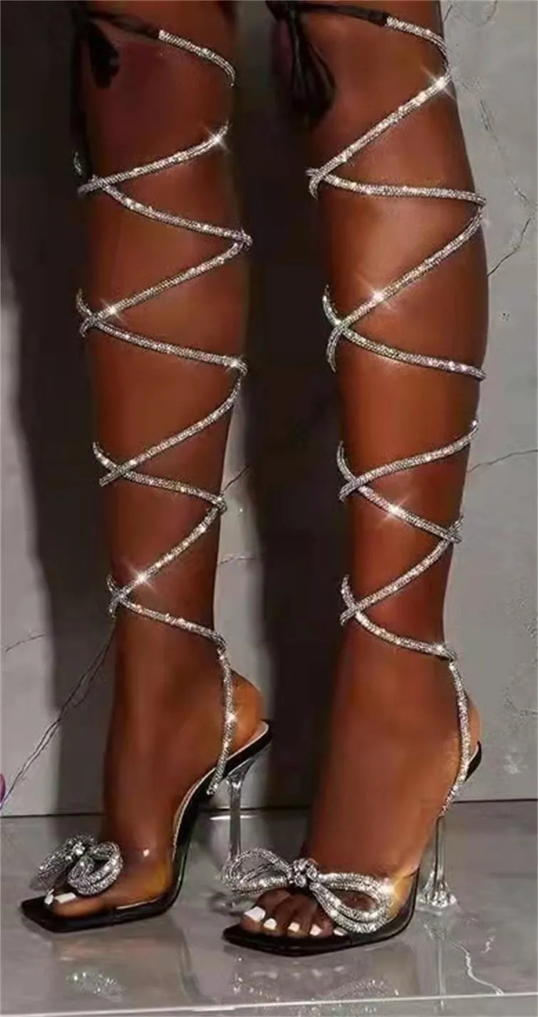 Plus size women's strappy sandals with Roman rhinestone straps and a square toe in black.