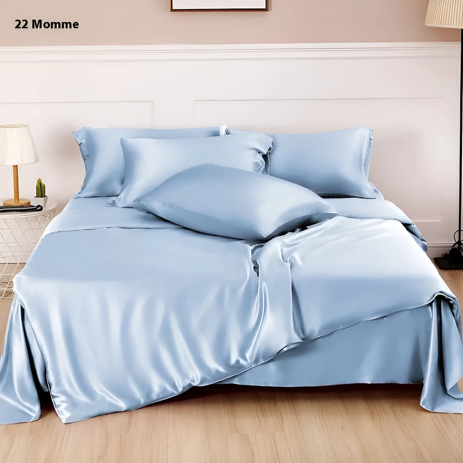 Solid colour silk duvet cover shown in Lotus Pink, double-sided design on a bed