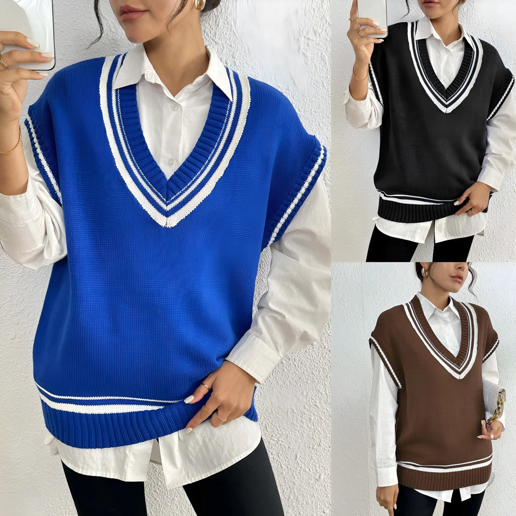 Blue loose-fit women's acrylic blend vest sweater on a hanger, college style.