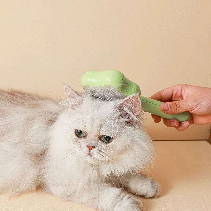 Green self-cleaning cat comb magic wand with stainless steel needles for pet grooming