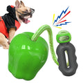 Green plastic dog chewing toy with dropping ball design for food dispensing