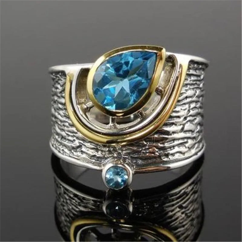 Blue Chinese style zircon ring with rhinestone detailing and drop shape on alloy band