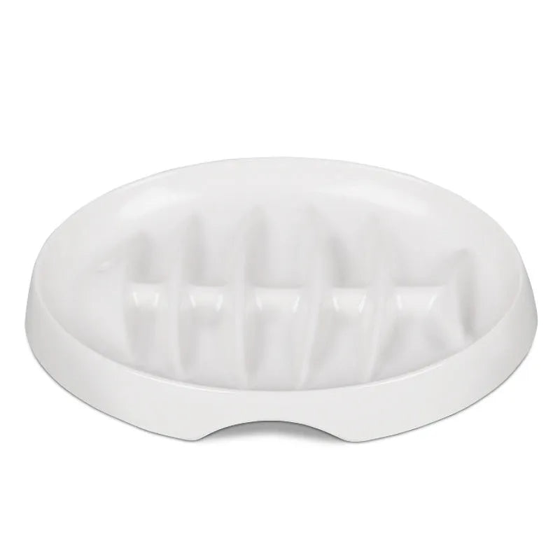 Green melamine fishbone slow feeder bowl for cats with raised ridges on a plain background