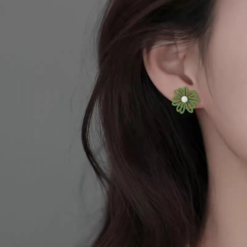 Cartoon-style flower stud earrings in blue-orange, white-green, or yellow-white two-tone colour combinations