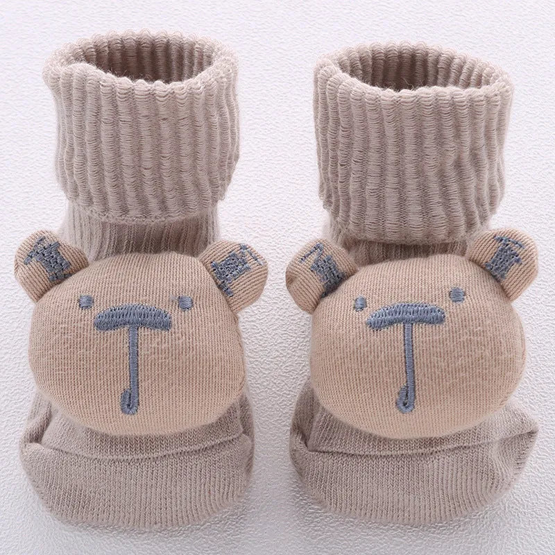 Cotton baby floor socks in blue bow pattern for infants 0-3 months.