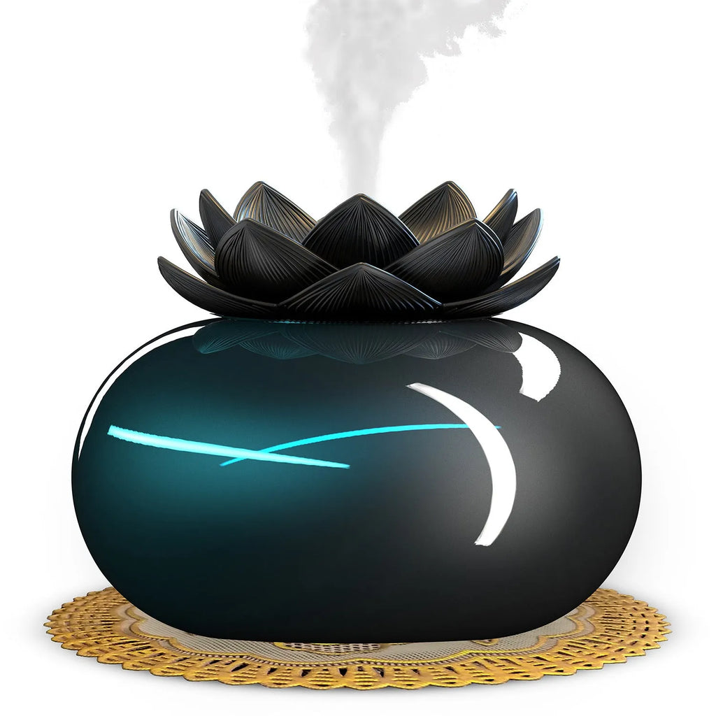 Pure black lotus aromatherapy humidifier with USB cable on desk surface