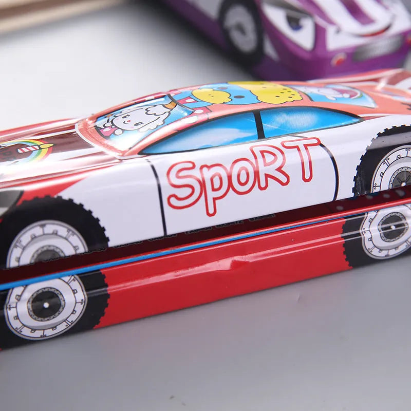 Tinplate double-layer racing car shaped stationery box with cartoon pattern on metal surface