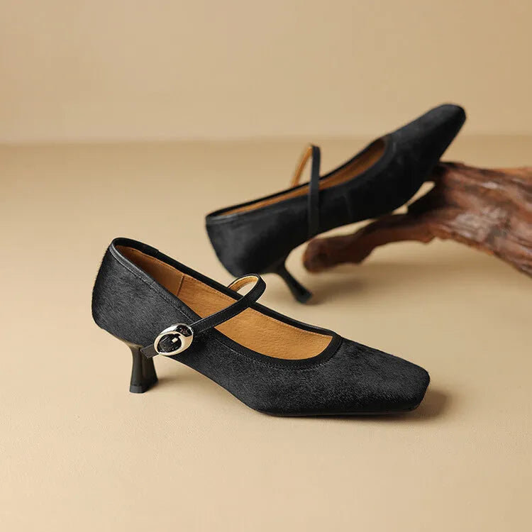 Women's black ankle-strap stiletto heels with a horse hair upper and square toe.