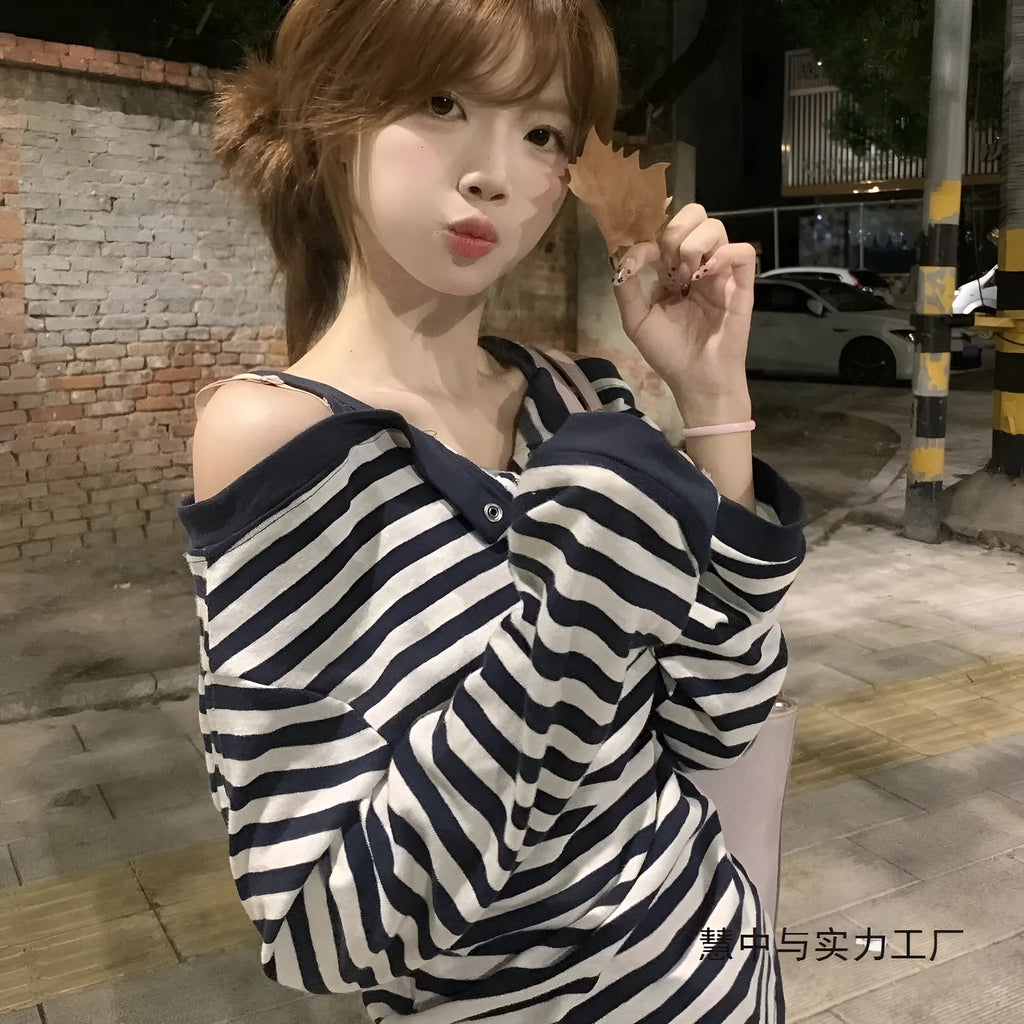 Dark blue oversized women's long-sleeved t-shirt with Korean-style embroidery and button details.