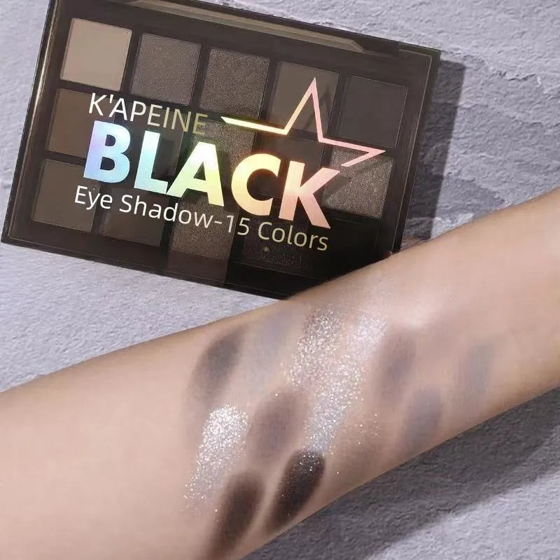 15-colour eyeshadow palette open showing matte and shimmer brown and blue eyeshadows.