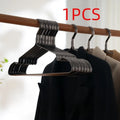 Elegant black modern minimalist clothes hanger with anti-slip coating.