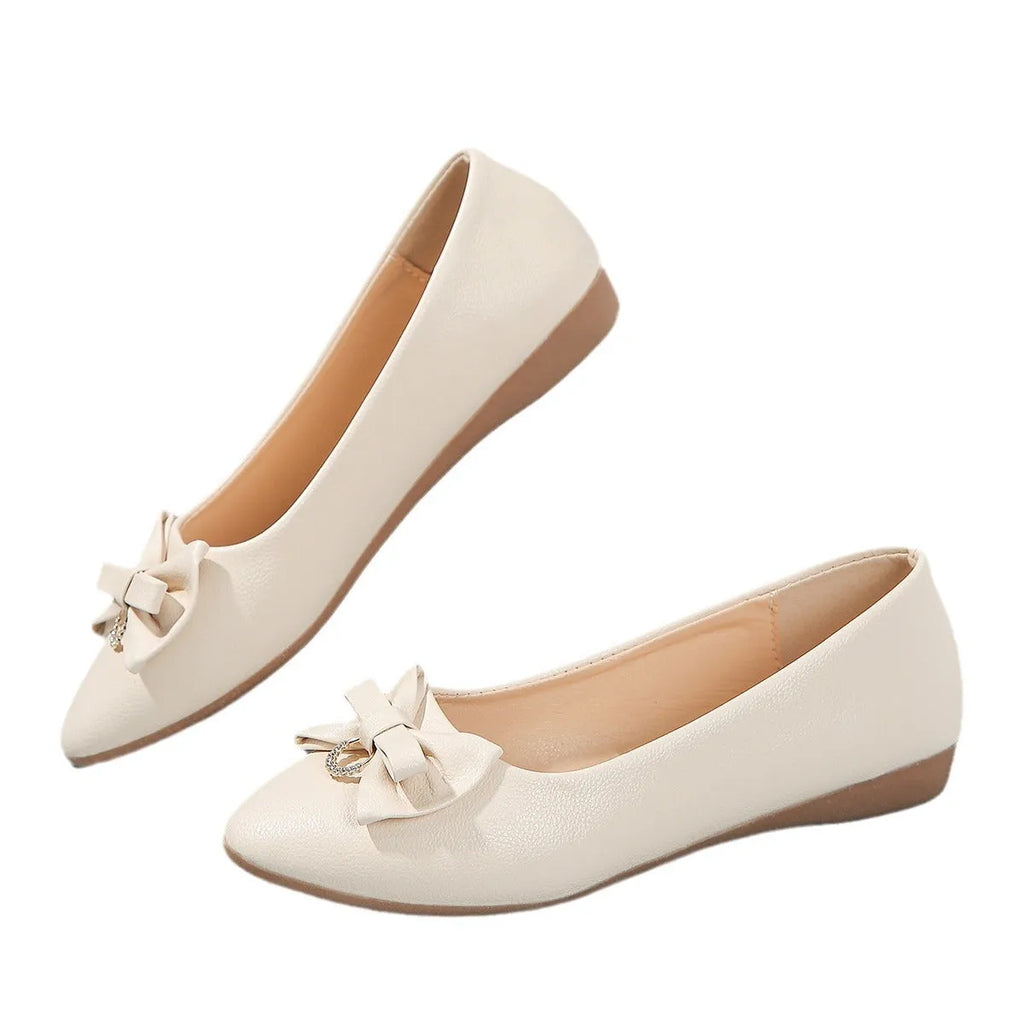 Women's beige casual flat shoes with a bowknot detail and slip-on shallow mouth design.