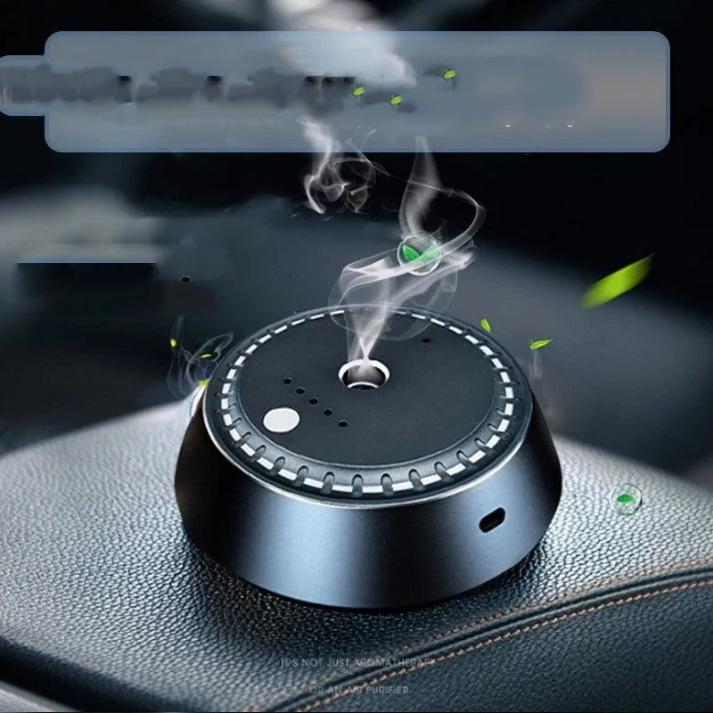 Black metal car aroma diffuser measuring 9cm by 4.5cm with USB connection