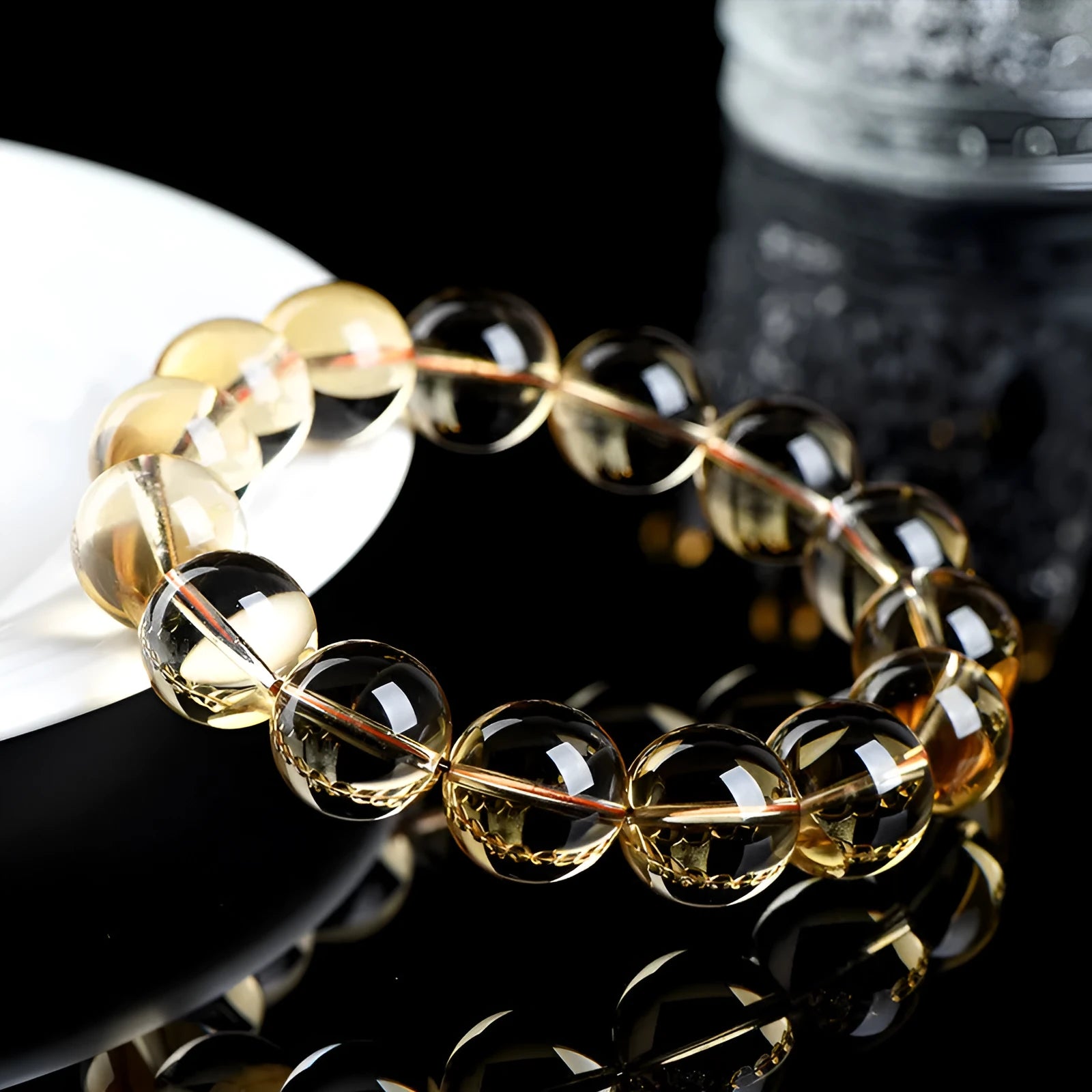 Natural citrine scattered bead ball bracelet showing 7A and 6A colour grades on a model's wrist.