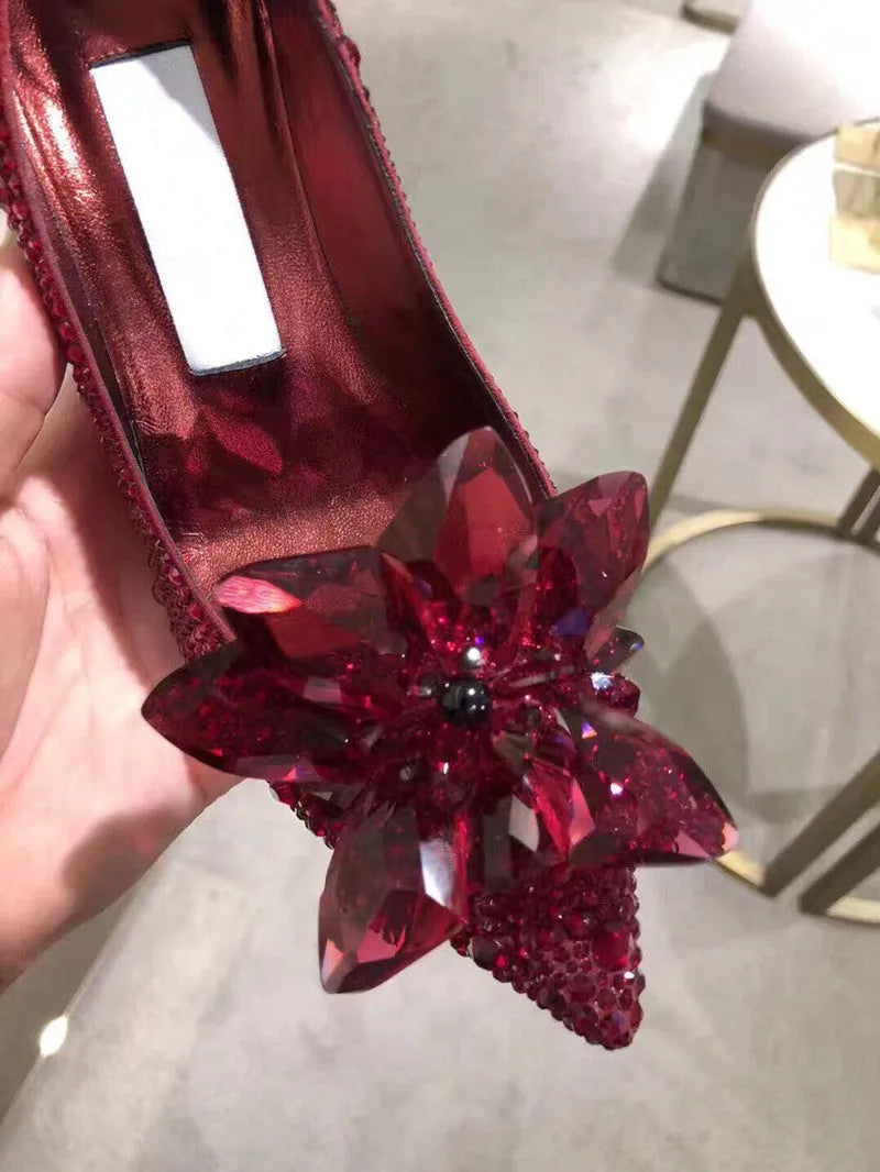 Women's gold high heels with pointed toe, rhinestone decoration, and stiletto heel