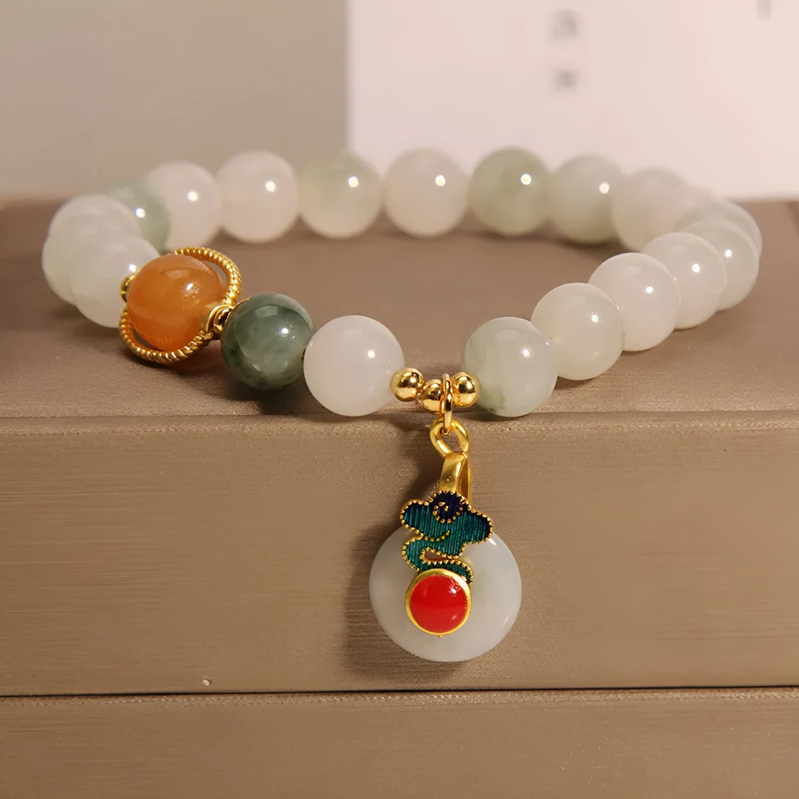 Women's ice jade bracelet with xiangyun peace pattern and pearl accents