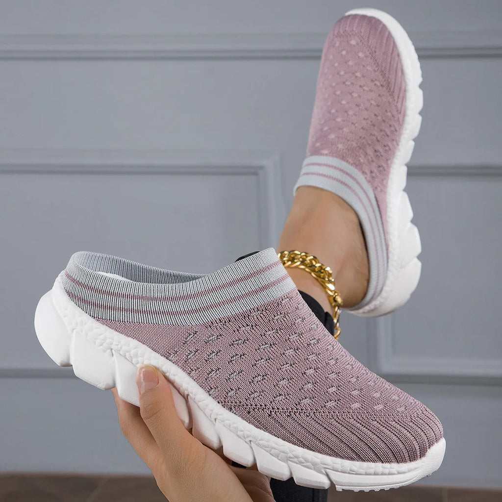 Black, pink, and purple striped Flyknit women's sports slippers with hollowed-out design on a viscose sole.