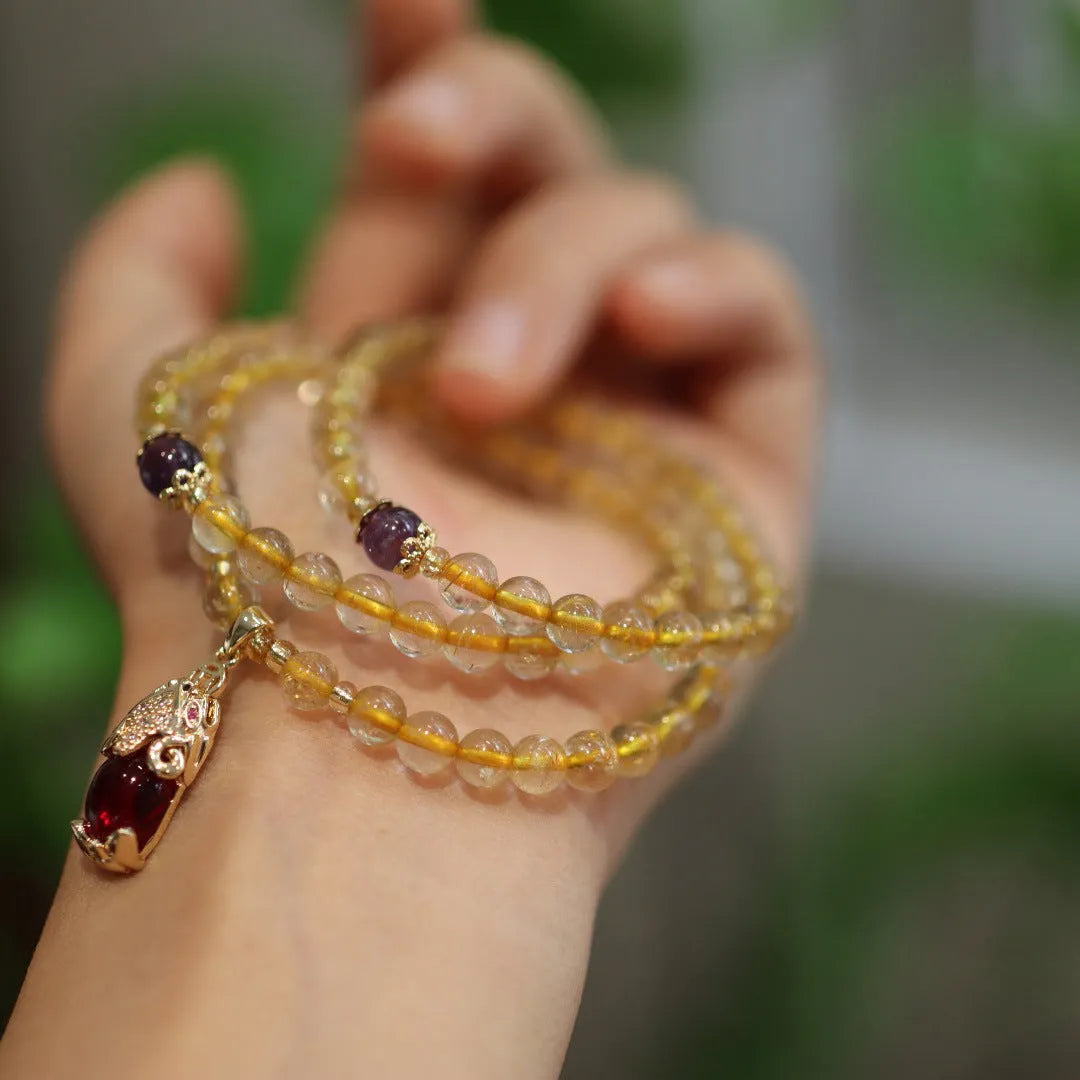 Brazil gold rutilated quartz bracelet with three golden circles and ruby quartz hanging chopsticks