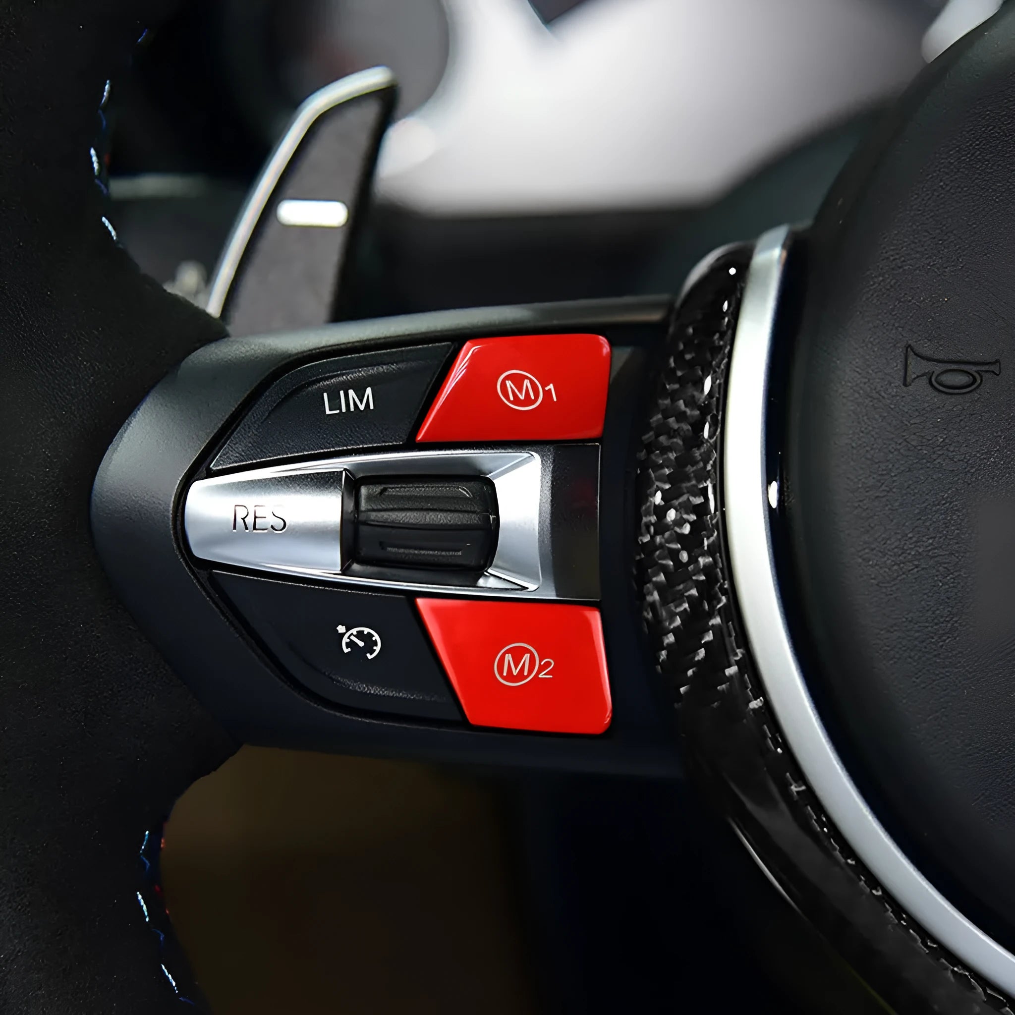 A pair of red M1M2 steering wheel mode buttons for BMW F30 and F34 models