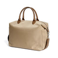 Black nylon waterproof shoulder bag with leather trim, showing large main compartment and shoulder strap.