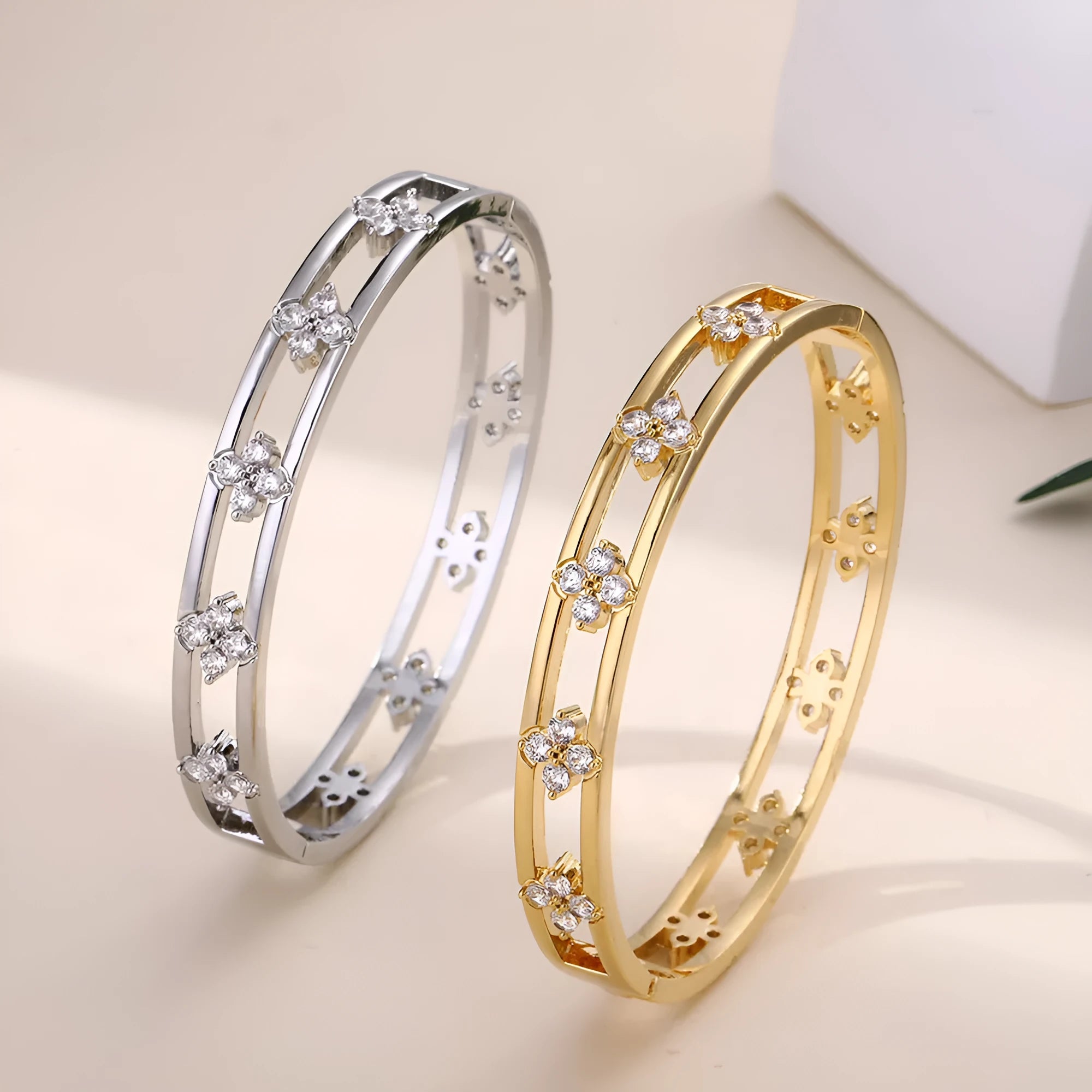 Women's hollow bracelet with four-leaf clover design in gold or silver options