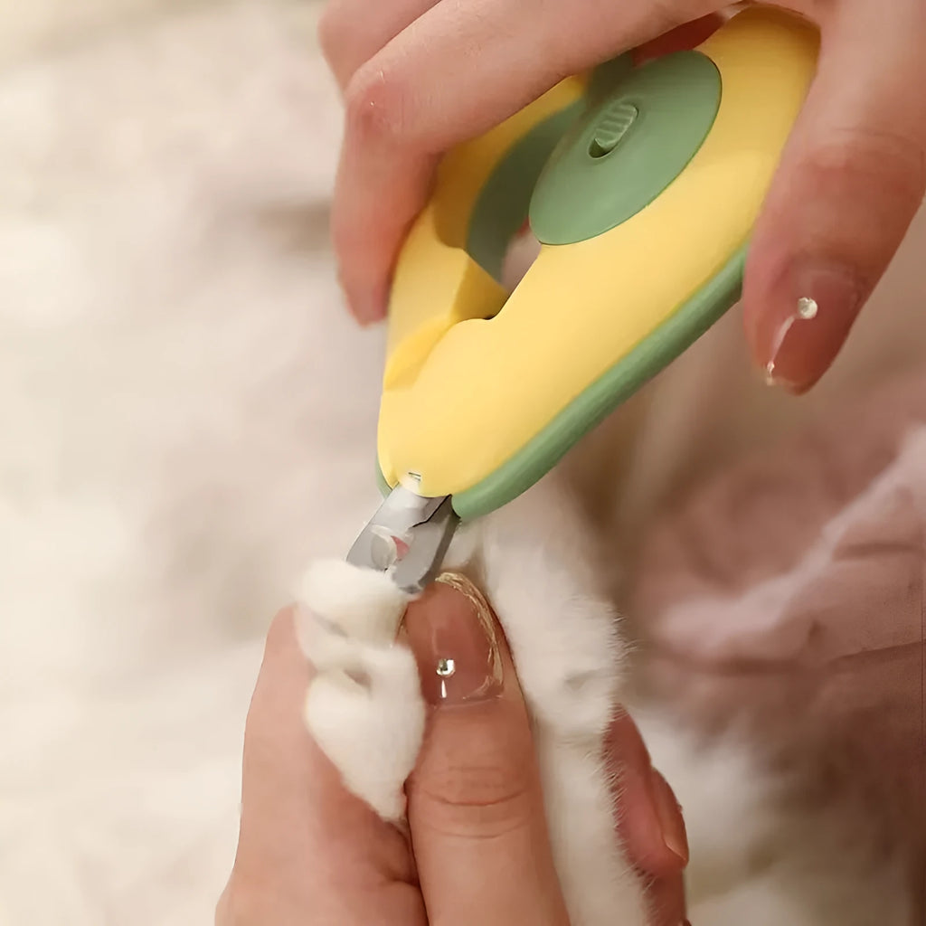 LED pet nail clipper with safety guard in green, pink and white colours for small dogs and cats