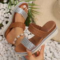 Women's metallic gold wedge sandals with adjustable strap and rubber wedge sole