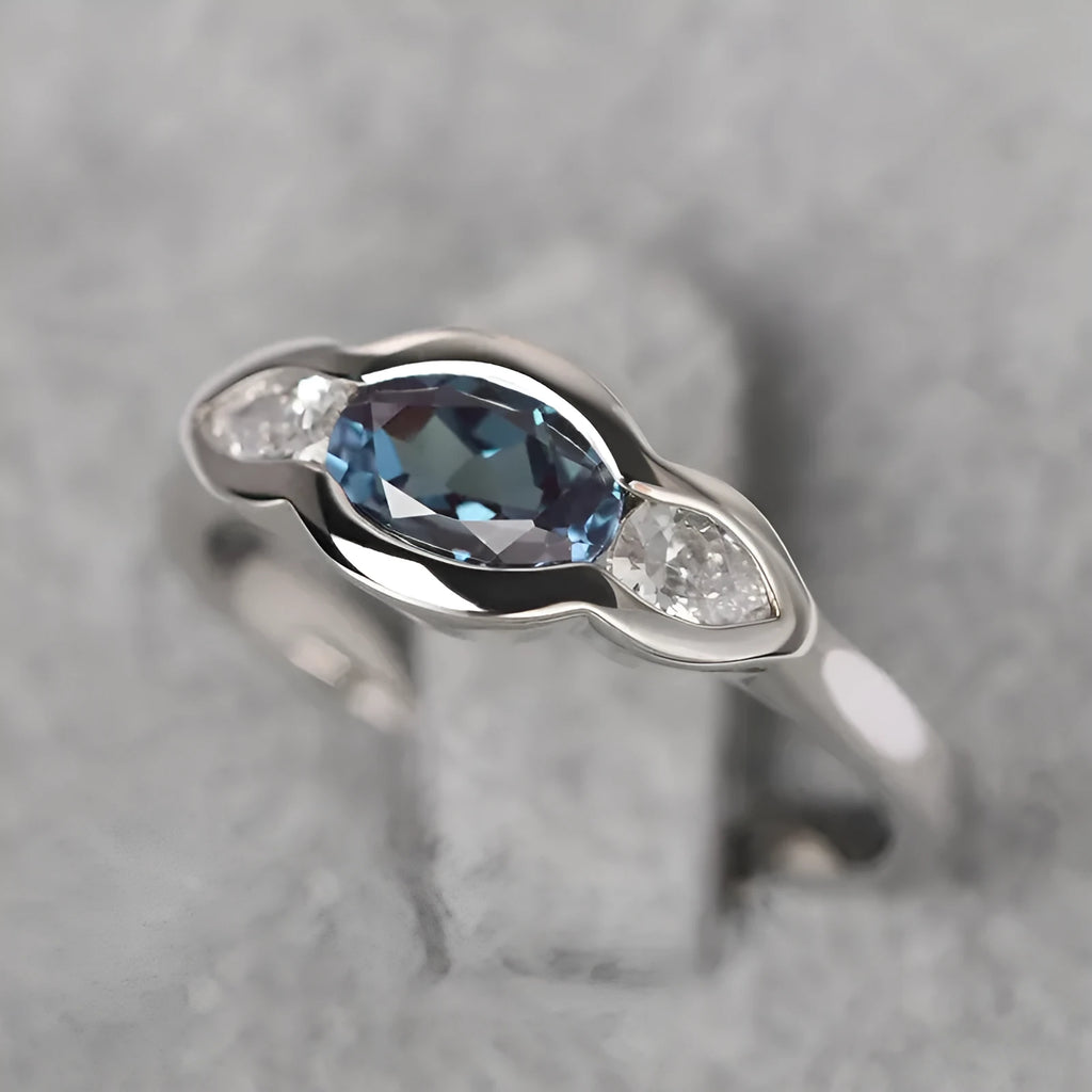 Geometric ellipse zircon ring in white gold finish showing structured design and stone detailing