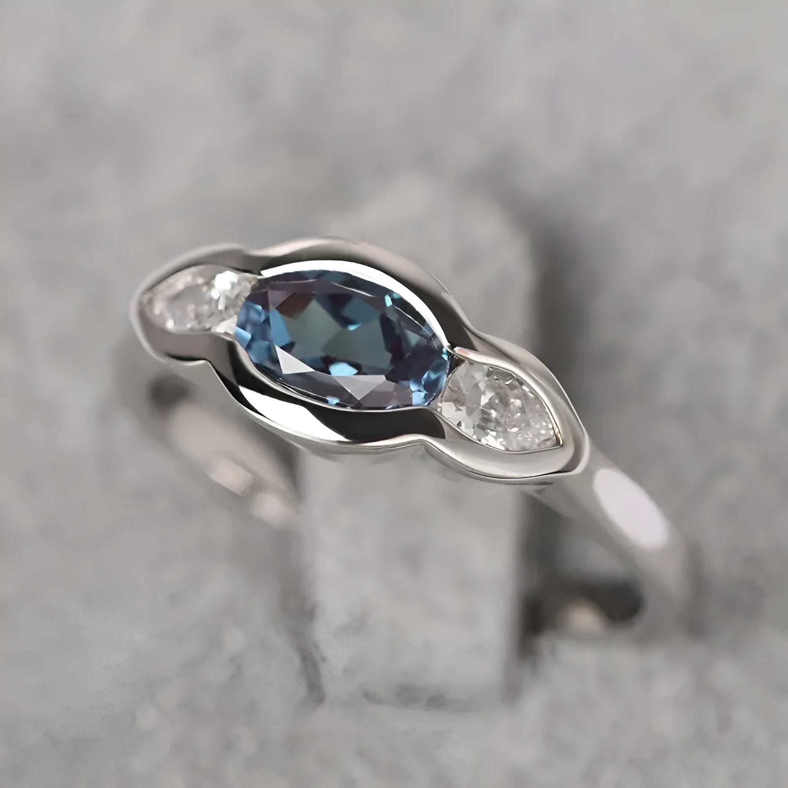 Geometric ellipse zircon ring in white gold finish showing structured design and stone detailing