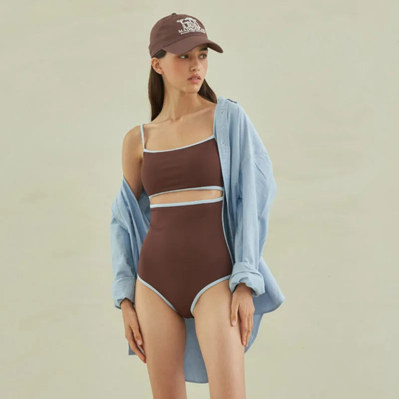 Brown triangle cut one-piece swimsuit for women on hanger showing front design