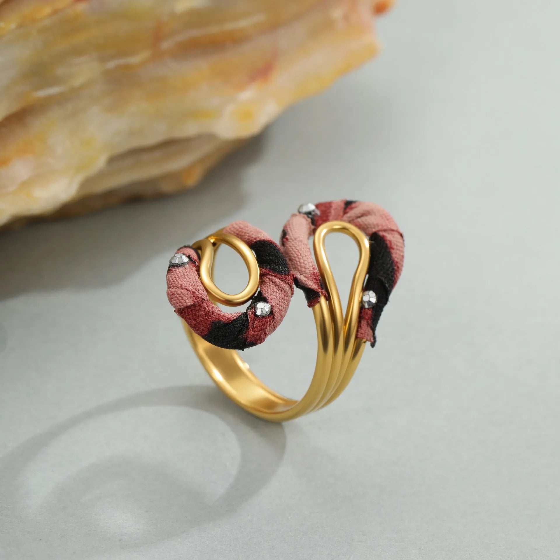 Leopard Series open mouth ring showing geometric asymmetric design with leopard print pattern on stainless steel