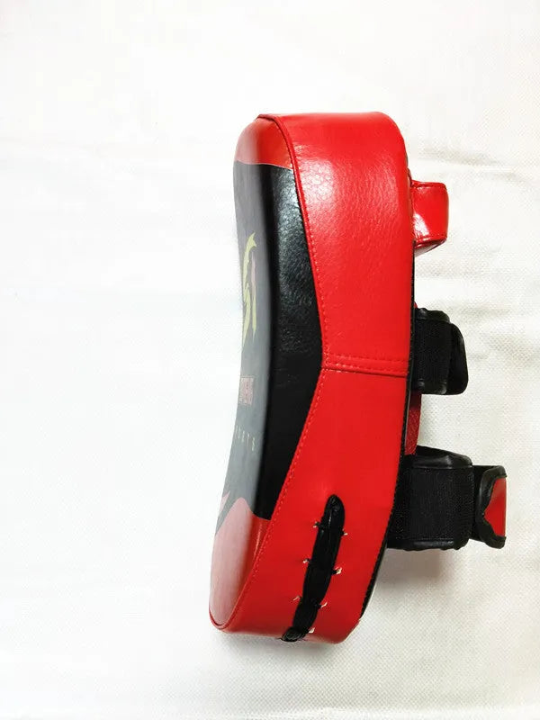 Black and red handheld boxing Sanda foot target with double buckle strap on the back.