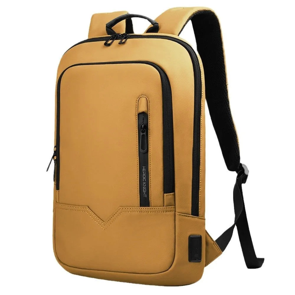 Lightweight orange polyester commuter backpack with USB charging port on the shoulder strap.