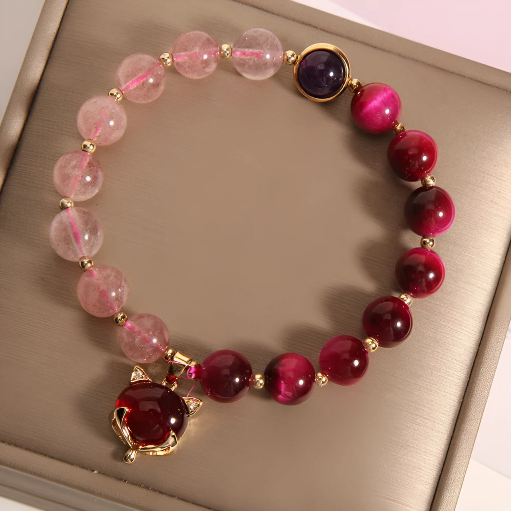 Women's simple strawberry crystal elastic bracelet showing natural stones on stretchable 18cm band