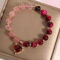 Women's simple strawberry crystal elastic bracelet showing natural stones on stretchable 18cm band