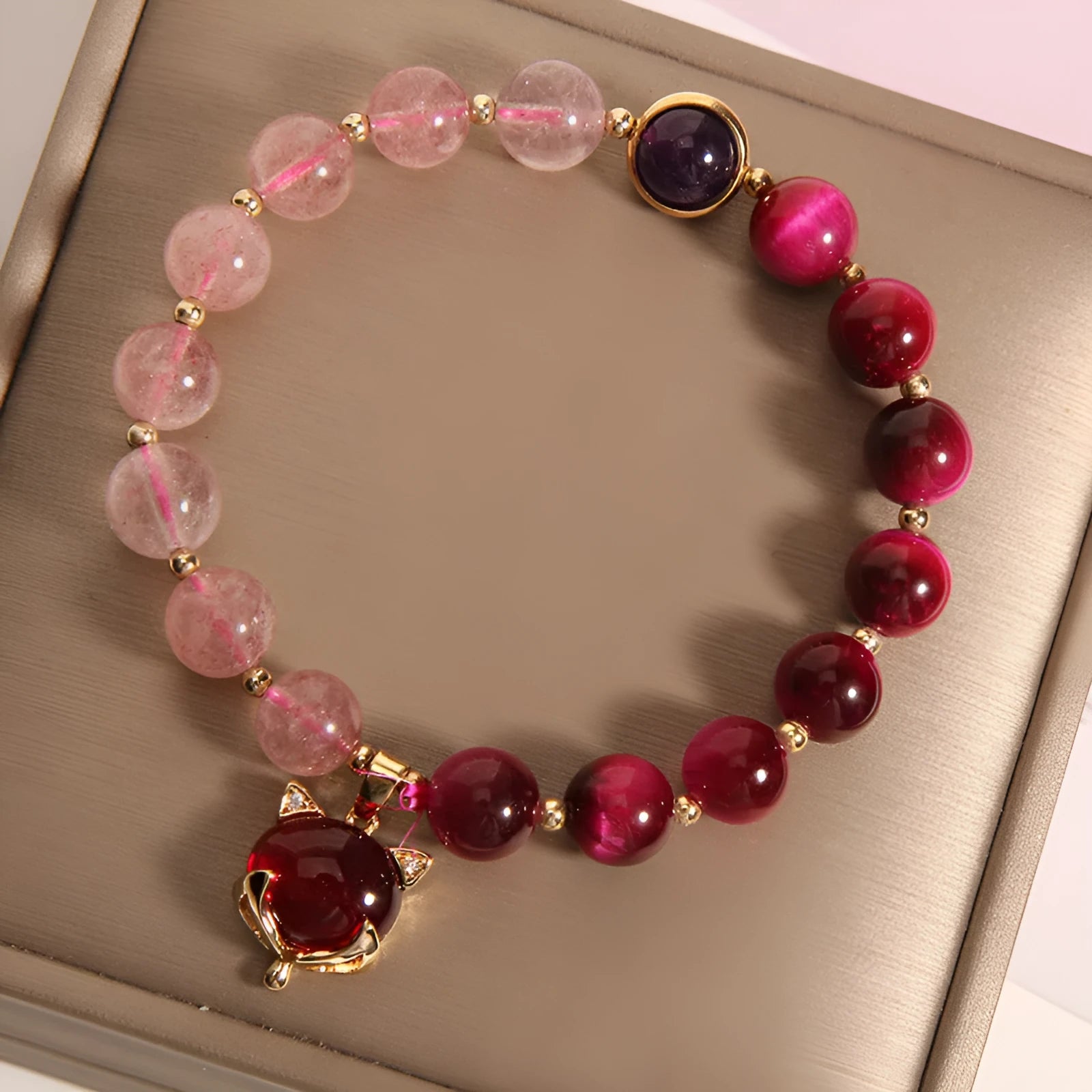 Women's simple strawberry crystal elastic bracelet showing natural stones on stretchable 18cm band