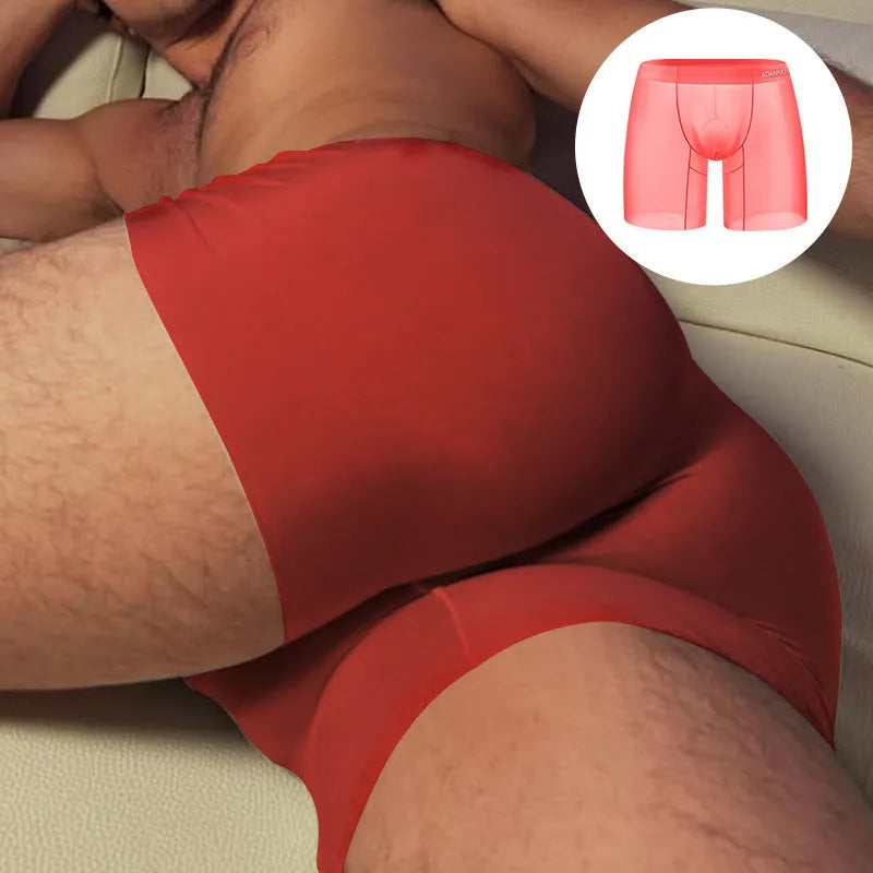 Men's orange seamless low-waist boxer shorts with hip lift function on a flat lay