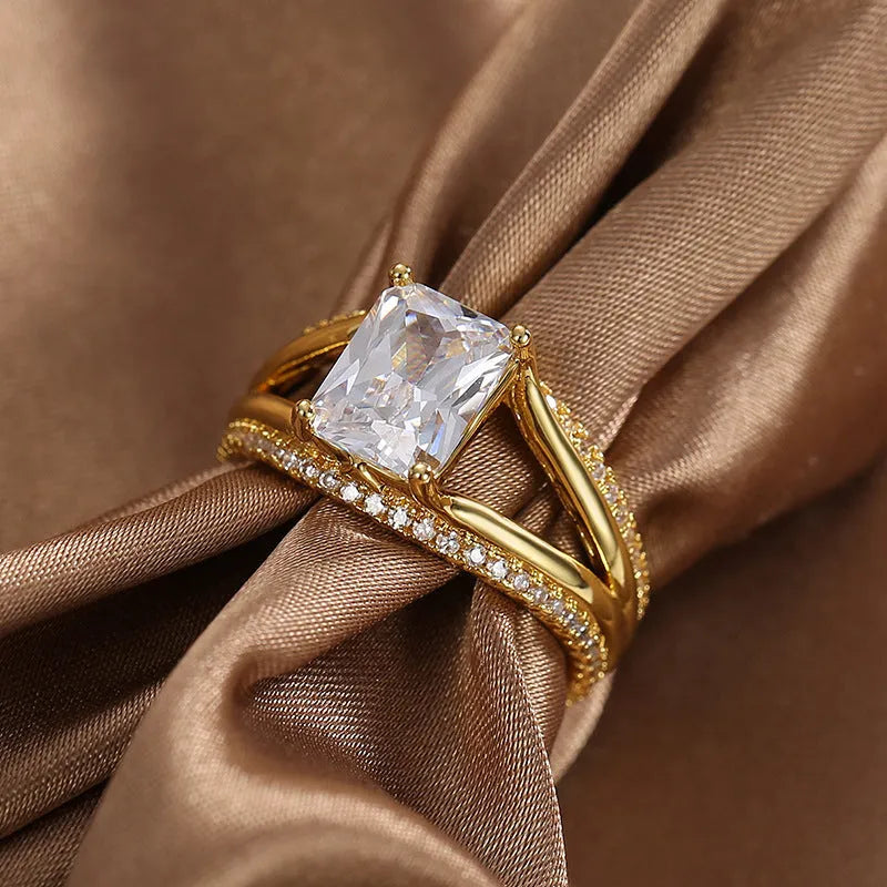 Gold geometric women's ring with zircon stones showing side and top view