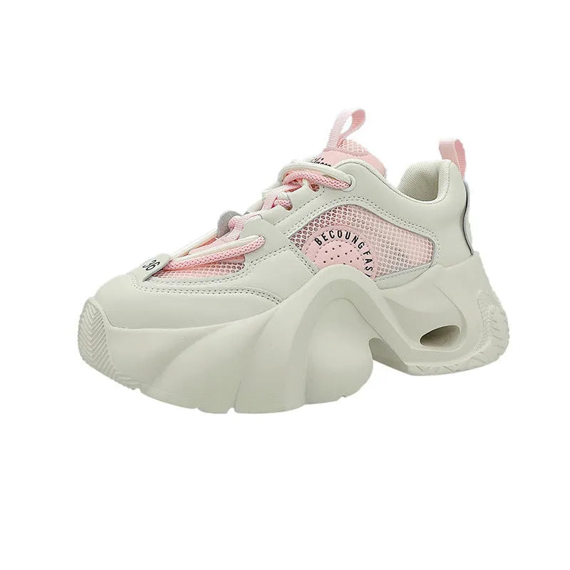 Women's pink casual sneakers with cross shoulder straps and a thick platform sole.