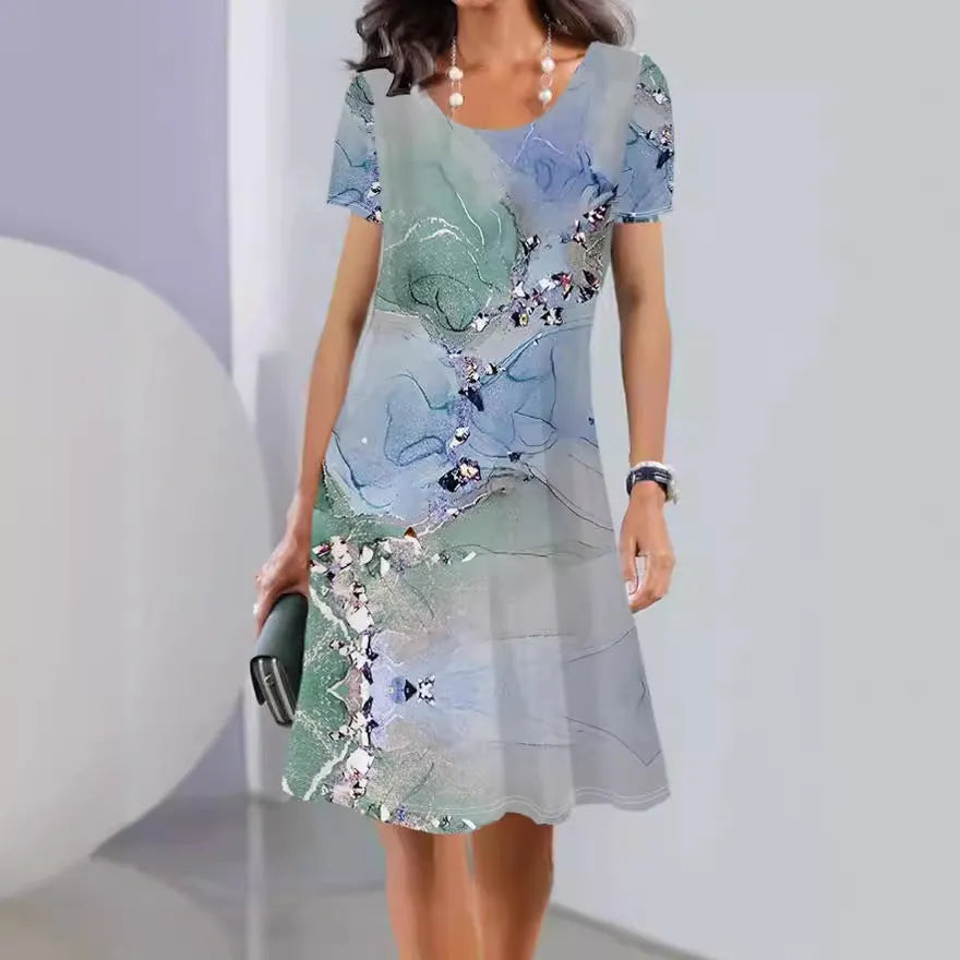 A mid-length floral print dress with short sleeves and a round neckline on a mannequin.